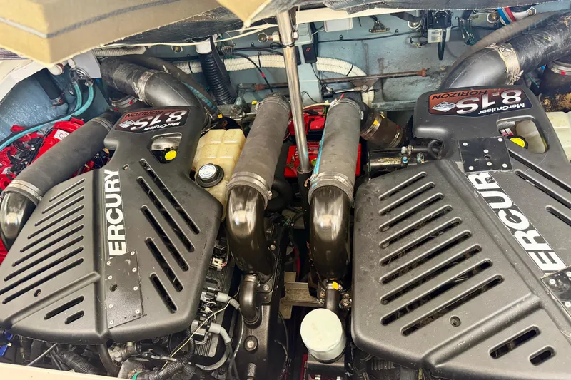 Slide: The Image of Engine compartment of a 2003 Sea Ray 340 Sundancer with twin Mercury motors. - 13