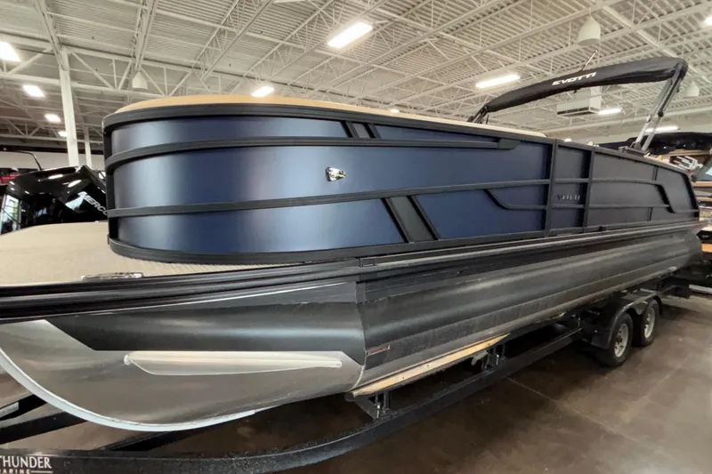 The Image of 2026 Evotti 525QL pontoon boat in showroom, featuring sleek design and modern aesthetics. - 1