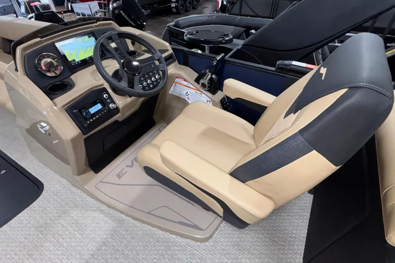 Slide: The Image of Captain's seat and dashboard of 2026 Evotti 525QL boat, featuring modern controls and navigation display. - 15