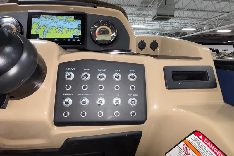 Slide: The Image of Control panel of 2026 Evotti 525QL boat with navigation screen and switches. - 20