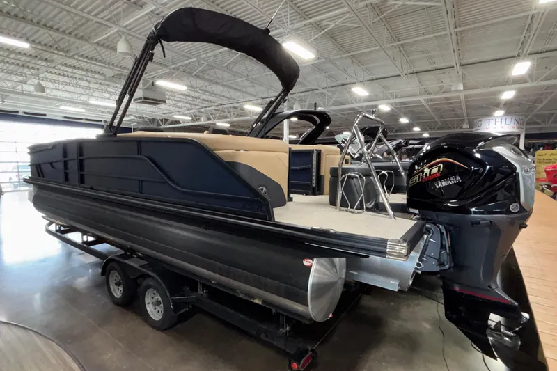 Slide: The Image of 2026 Evotti 525QL pontoon boat with Yamaha engine in showroom. - 3