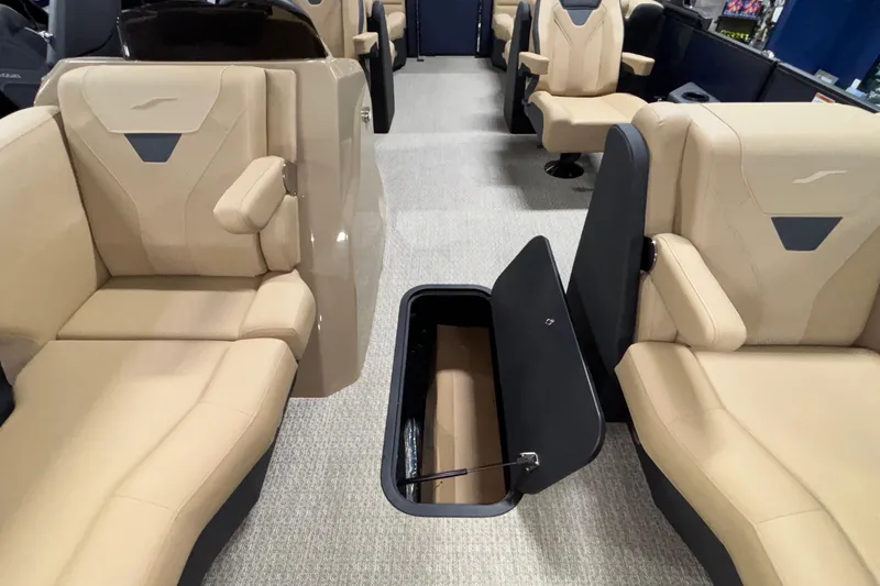 Slide: The Image of Luxurious interior of 2026 Evotti 525QL boat with beige seating and open storage compartment. - 34