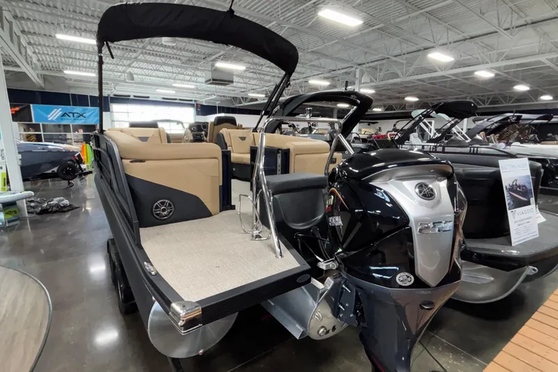Slide: The Image of Evotti 525QL 2026 model pontoon boat displayed in a showroom with Yamaha outboard motor. - 4
