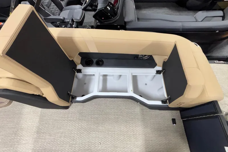 Slide: The Image of 2026 Evotti 525QL boat interior storage compartment with beige seating and open hatch. - 41