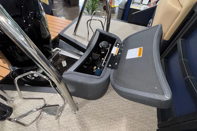 Slide: The Image of Open storage compartment in 2026 Evotti 525QL boat, showcasing interior components and design. - 46