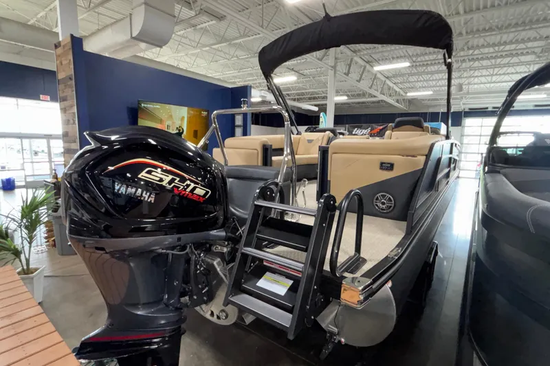 Slide: The Image of 2026 Evotti 525QL boat with Yamaha engine displayed in a showroom. - 5