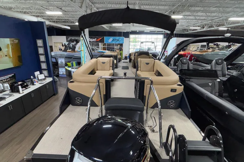 Slide: The Image of 2026 Evotti 525QL luxury pontoon boat displayed in a showroom setting. - 6