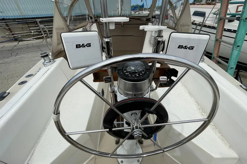 Slide: The Image of Steering wheel and navigation equipment on a 1988 Catalina 30 sailboat. - 11