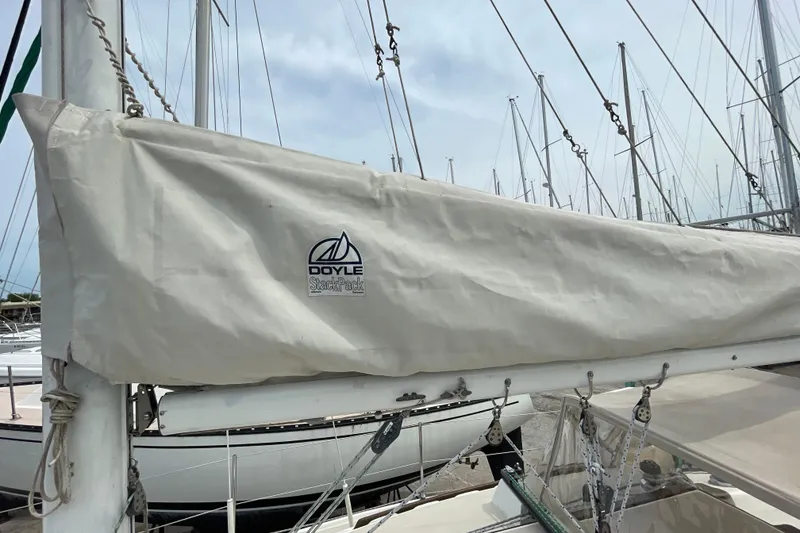 Slide: The Image of Catalina 30 sailboat from 1988 with Doyle StackPack sail cover in marina. - 18