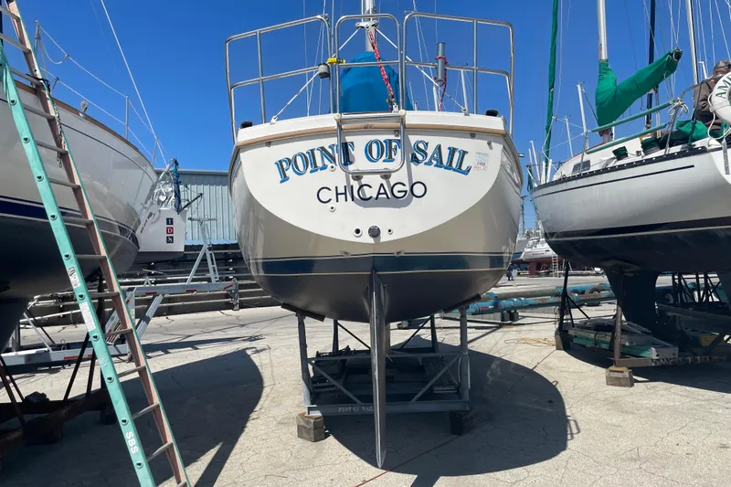 Slide: The Image of 1988 Catalina 30 sailboat named "Point of Sail" in a boatyard, Chicago. - 3