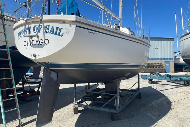 Slide: The Image of Catalina 30 sailboat from 1988, named "Point of Sail," docked in Chicago. - 4