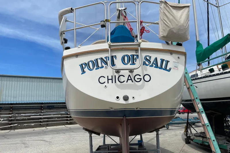 Slide: The Image of 1988 Catalina 30 sailboat named "Point of Sail" docked in Chicago. - 8