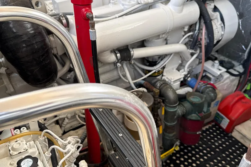 Slide: The Image of Engine room of a 2000 Dawson Yachts Express, showcasing mechanical components and piping. - 15