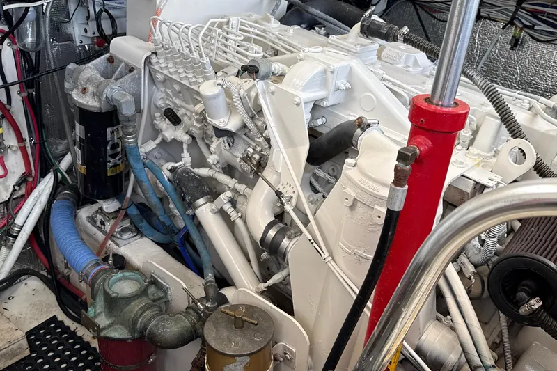 Slide: The Image of Engine room of a 2000 Dawson Yachts Express, showcasing complex machinery and components. - 19