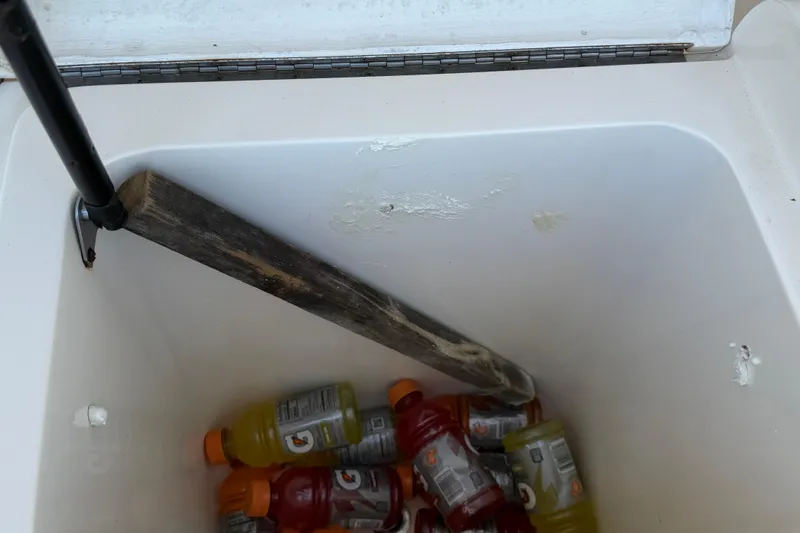 Slide: The Image of Cooler on 2000 Dawson Yachts Express with assorted drinks and wooden support. - 31