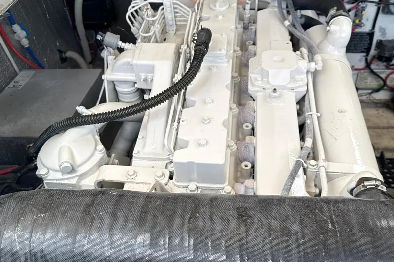 Slide: The Image of Engine compartment of a 2000 Dawson Yachts Express, showcasing detailed mechanical components. - 32