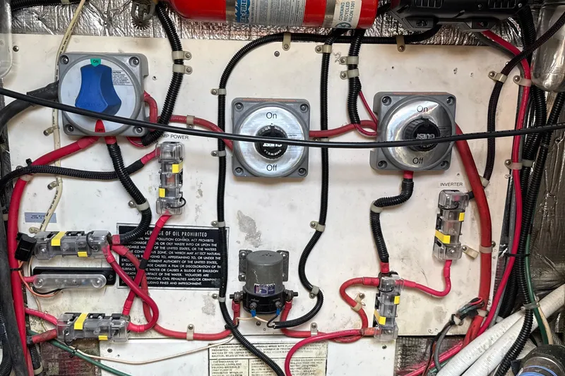 Slide: The Image of Electrical panel of a 2000 Dawson Yachts Express, featuring switches and wiring. - 34