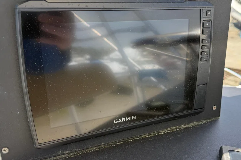 Slide: The Image of Garmin navigation display on 2000 Dawson Yachts Express, showing reflections and control buttons. - 38