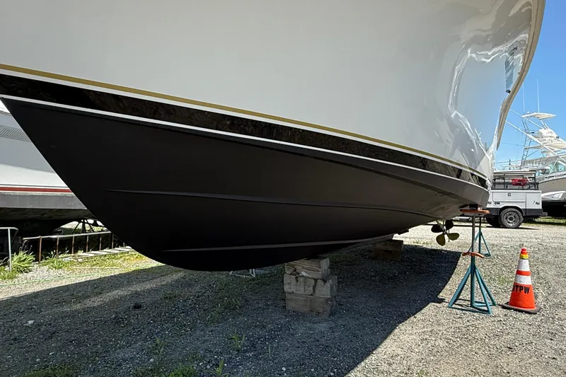 Slide: The Image of 2000 Dawson Yachts Express on stands, hull view, outdoors. - 4