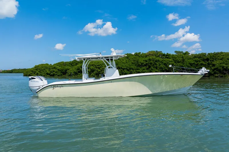 The Image of 2007 Yellowfin 34 Offshore boat on calm water, clear sky background. - 1