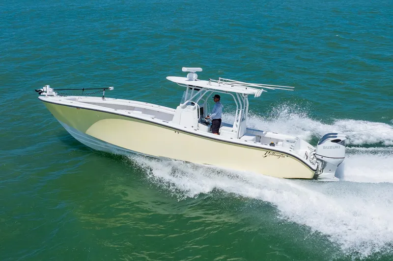 Slide: The Image of 2007 Yellowfin 34 Offshore boat cruising on open water, showcasing sleek design and powerful performance. - 10