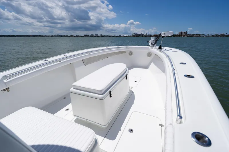 Slide: The Image of 2007 Yellowfin 34 Offshore boat on calm water under a partly cloudy sky. - 14