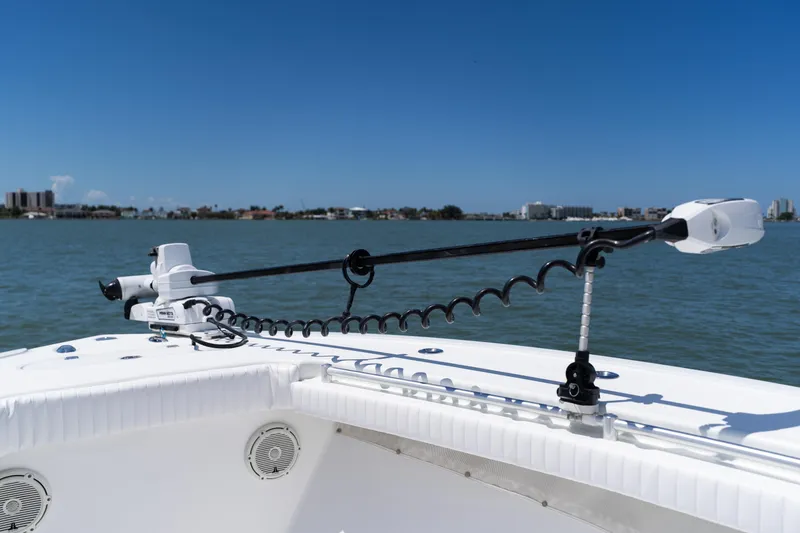 Slide: The Image of 2007 Yellowfin 34 Offshore boat with trolling motor on calm water. - 16