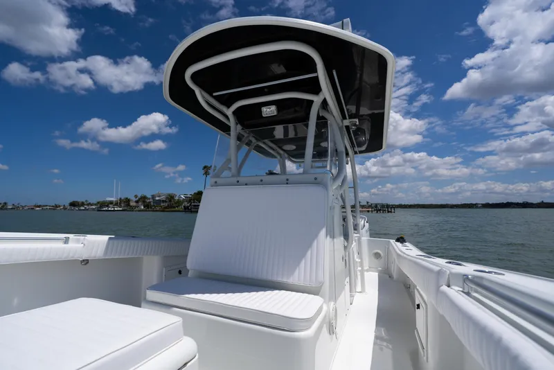 Slide: The Image of 2007 Yellowfin 34 Offshore boat on water under blue sky with clouds. - 19
