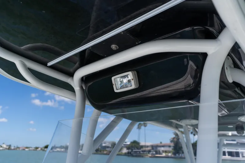 Slide: The Image of Close-up of 2007 Yellowfin 34 Offshore boat's T-top structure and light fixture. - 22