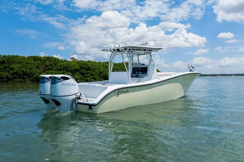 Slide: The Image of 2007 Yellowfin 34 Offshore boat with twin Suzuki engines on calm water. - 3