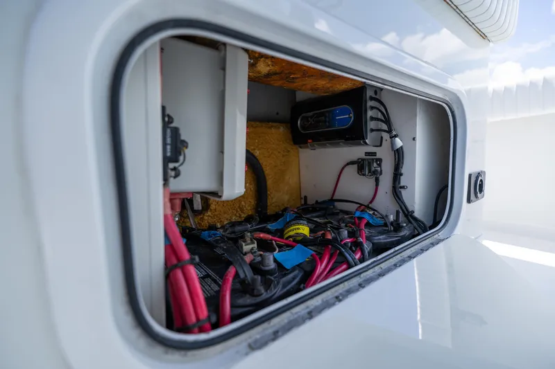 Slide: The Image of Electrical compartment of a 2007 Yellowfin 34 Offshore boat, showcasing wiring and components. - 41