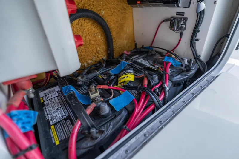 Slide: The Image of Battery compartment of a 2007 Yellowfin 34 Offshore boat with wiring and connections. - 43