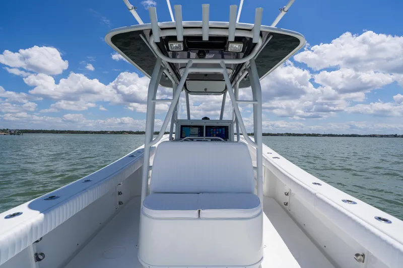 Slide: The Image of 2007 Yellowfin 34 Offshore boat on water, clear sky, and open sea view. - 46
