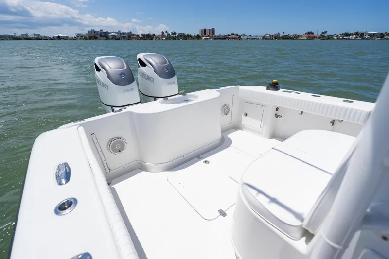 Slide: The Image of 2007 Yellowfin 34 Offshore boat with dual Suzuki engines on calm water. - 50