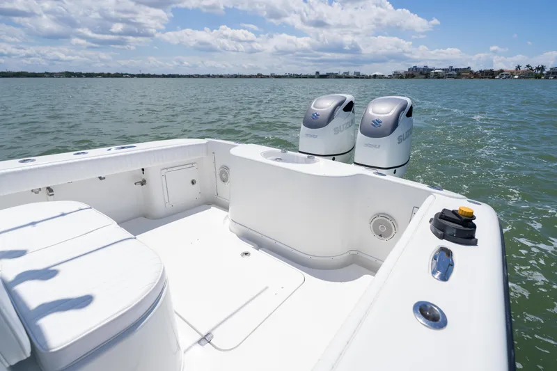 Slide: The Image of 2007 Yellowfin 34 Offshore boat with dual Suzuki outboard motors on calm water. - 52