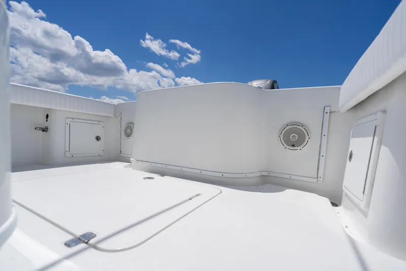 Slide: The Image of 2007 Yellowfin 34 Offshore boat deck under clear blue sky. - 53