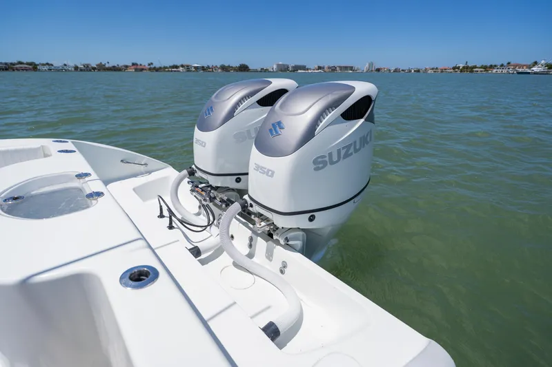 Slide: The Image of 2007 Yellowfin 34 Offshore boat with dual Suzuki 350 engines on calm water. - 54