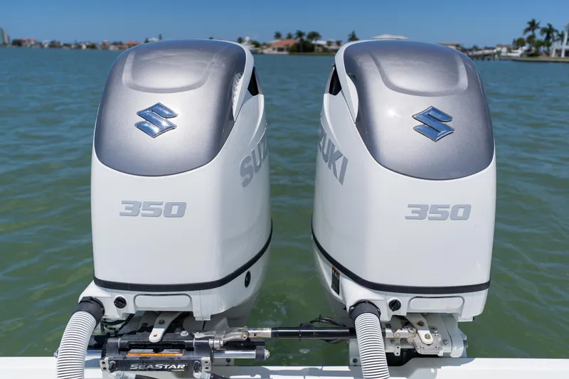 Slide: The Image of Twin Suzuki 350 outboard engines on a 2007 Yellowfin 34 Offshore boat. - 55