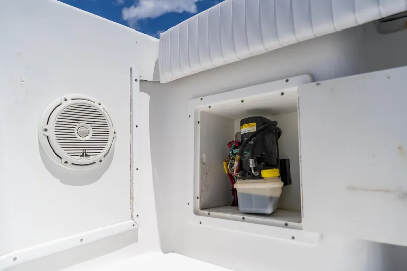 Slide: The Image of 2007 Yellowfin 34 Offshore boat compartment with speaker and equipment. - 57