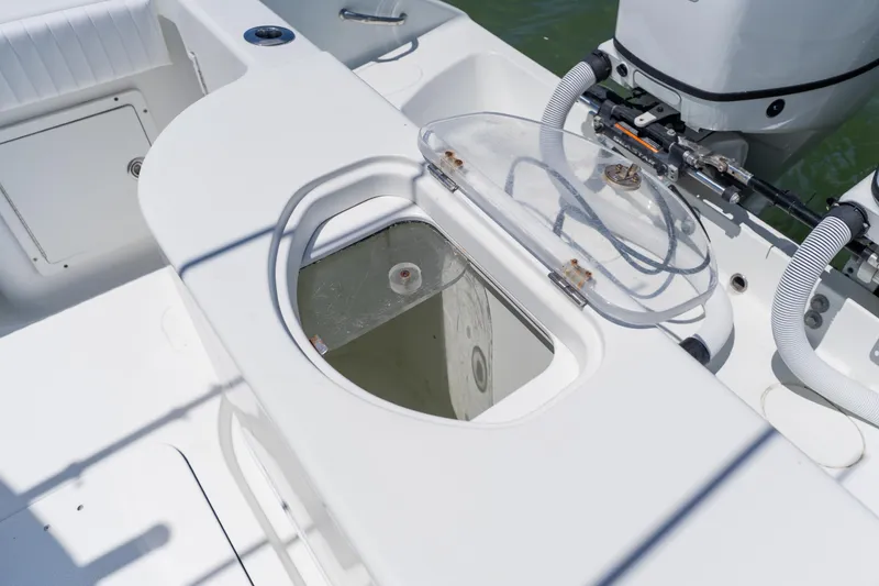 Slide: The Image of 2007 Yellowfin 34 Offshore boat with open hatch and visible engine components. - 59