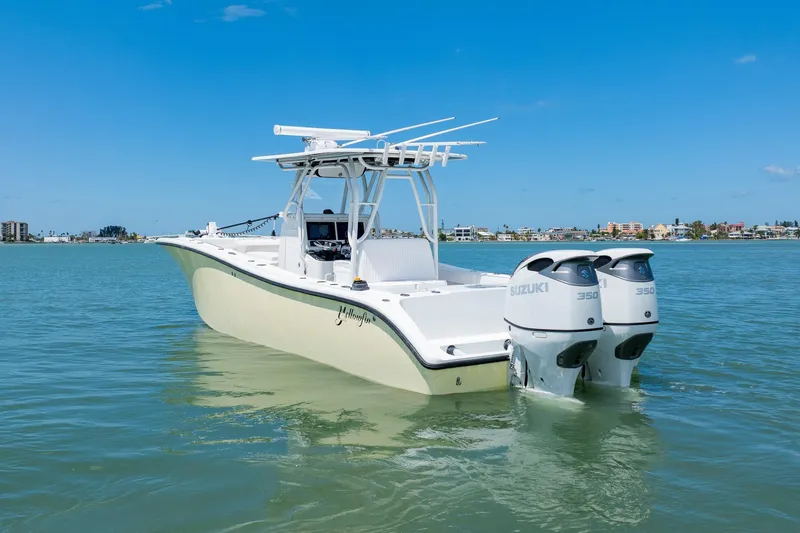 Slide: The Image of 2007 Yellowfin 34 Offshore boat with twin Suzuki engines on calm water. - 6