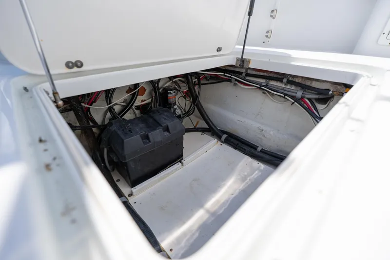 Slide: The Image of Open hatch of 2007 Yellowfin 34 Offshore boat showing battery and wiring. - 60