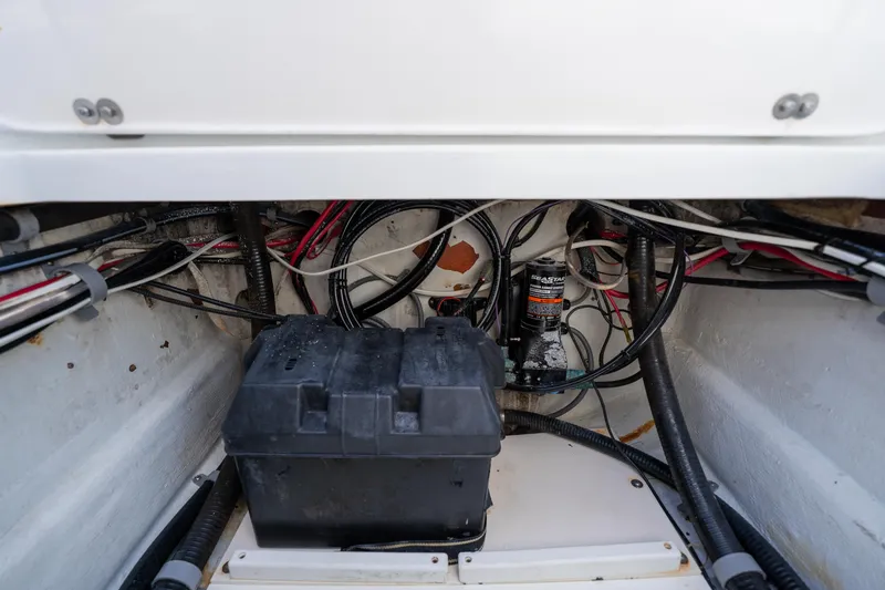 Slide: The Image of 2007 Yellowfin 34 Offshore boat wiring and battery compartment. - 61