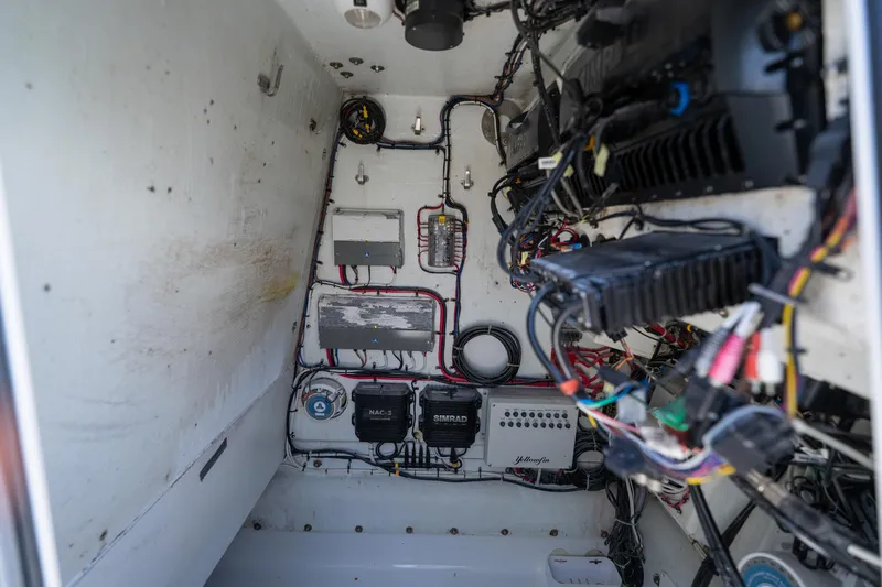 Slide: The Image of Electrical wiring and components inside a 2007 Yellowfin 34 Offshore boat. - 68