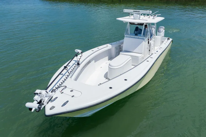 Slide: The Image of 2007 Yellowfin 34 Offshore boat on calm water, showcasing sleek design and advanced features. - 7