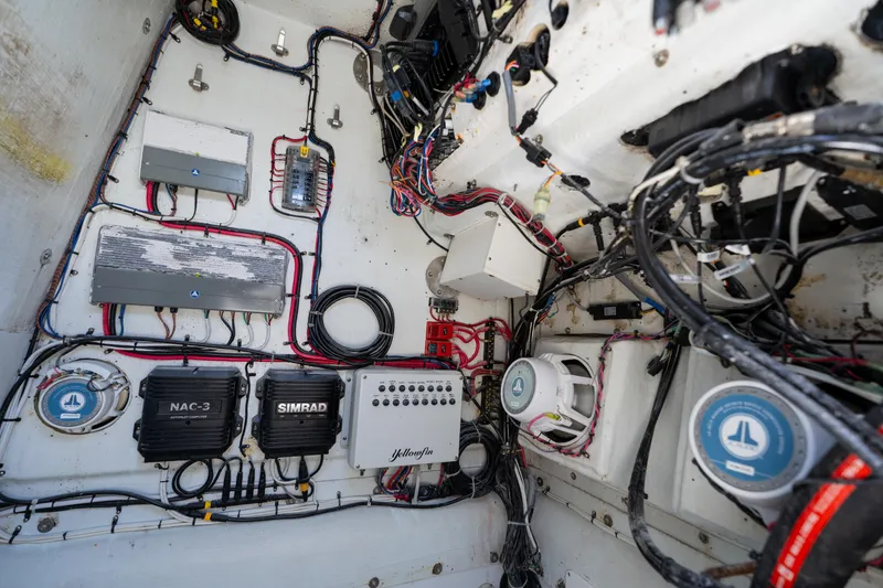 Slide: The Image of Electrical system of a 2007 Yellowfin 34 Offshore boat, featuring wiring and control units. - 70