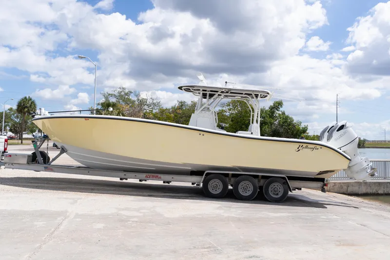 Slide: The Image of 2007 Yellowfin 34 Offshore boat on trailer under cloudy sky. - 71