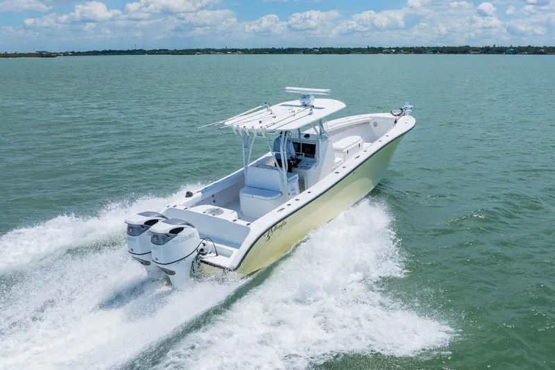 Slide: The Image of 2007 Yellowfin 34 Offshore boat cruising on open water under a clear sky. - 8
