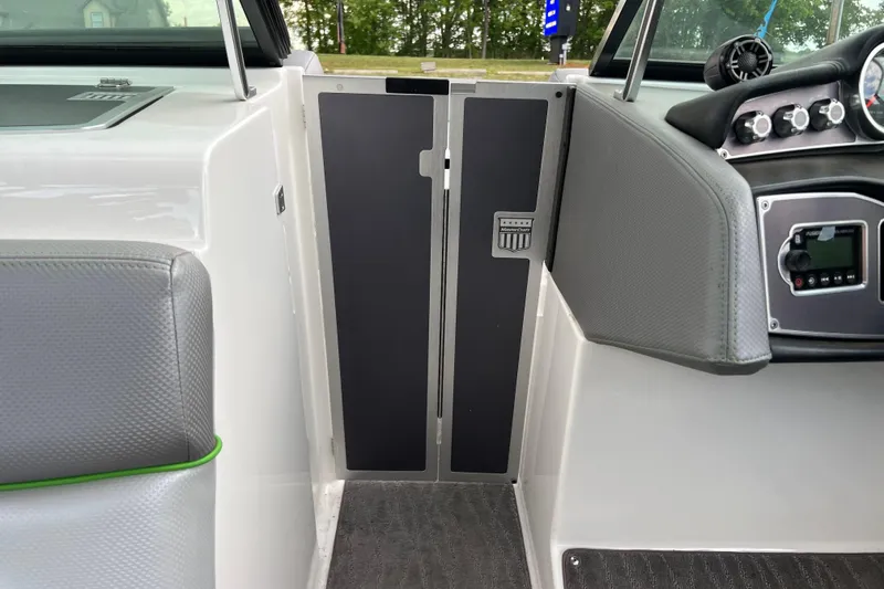 Slide: The Image of Interior view of a 2017 MasterCraft XT23 boat cockpit with control panel and seating. - 7