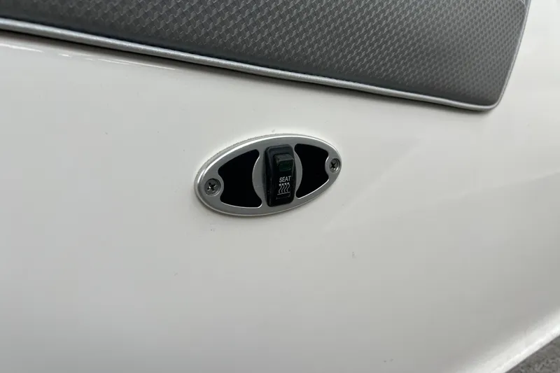 Slide: The Image of Close-up of a 2017 MasterCraft XT23 boat switch on a white panel. - 8
